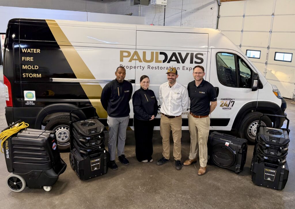 Paul Davis Restoration of NJ Delaware Valley team standing in front of branded service van with professional drying equipment, ready for water, fire, mold, and storm damage restoration